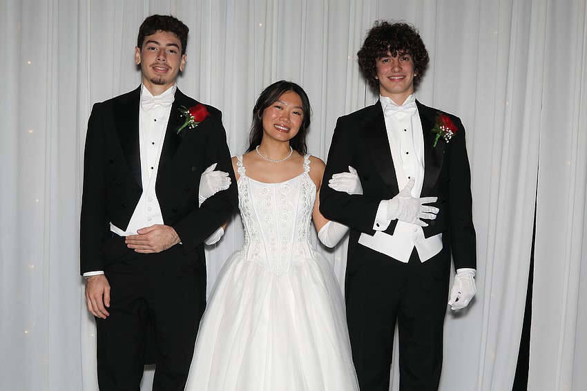 Debutante Christine Tagle and her escorts Franco Fuentes-Sachetti and Jackson Watrobsky.
