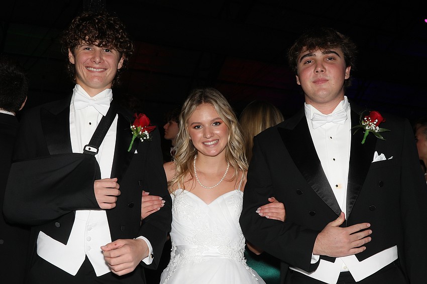 Debutante Layla Turner and her escorts, Jake Seubert and Cody Simpson.
