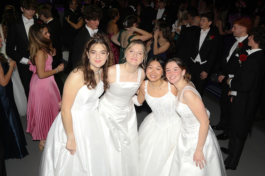 Debutante twins Sofie and Chloe Niebuhr take a quick dance break for a photo with Debutantes Christine Tagle and Andrea Pellizzari.