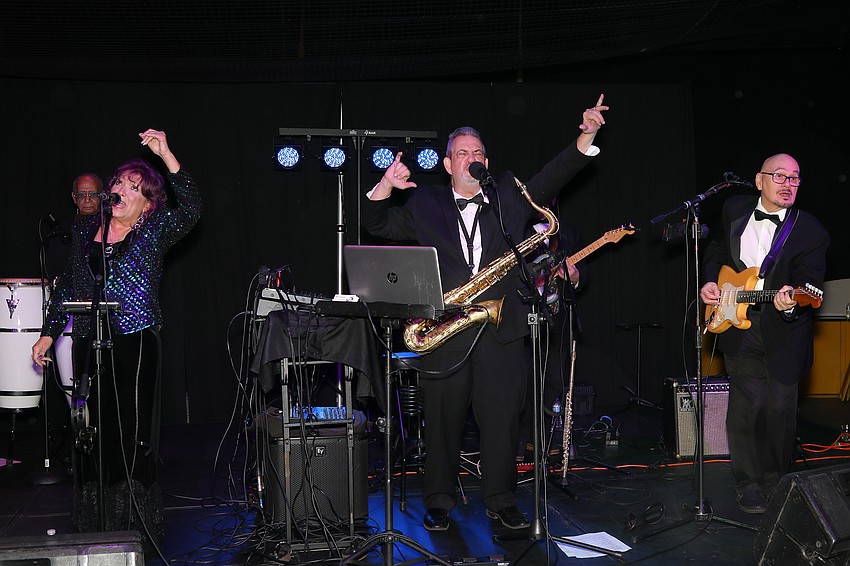 The combined talents of percussionist Hector Gonzales, vocalist Kathy McAbee, Gene Canon, sax, flute, vocals, and guitarists and vocalists Paul Bozine and John Mayeux make up the Gene Canon and Topspin band.