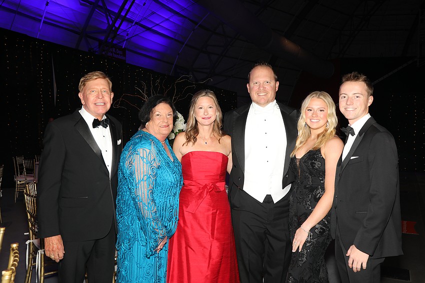 Attending for the presentation of Debutante Maci Voight are family members Steve, Pat, Melinda, Michael, Megan, and Samuel Anderson.