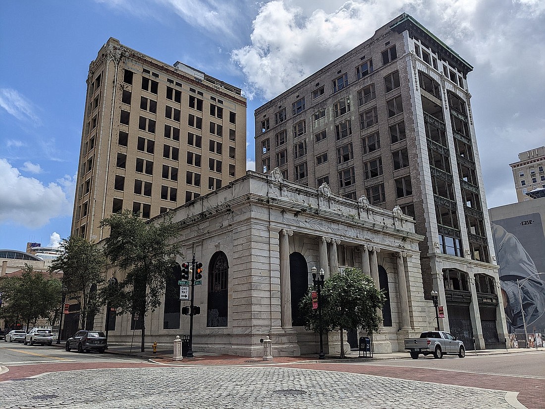 The Laura Street Trio at Forsyth and Laura streets Downtown. Owner Steve Atkins is proposing to redevelop the historic Downtown buildings into mixed-income housing, a restaurant and a Marriott Autograph Hotel.