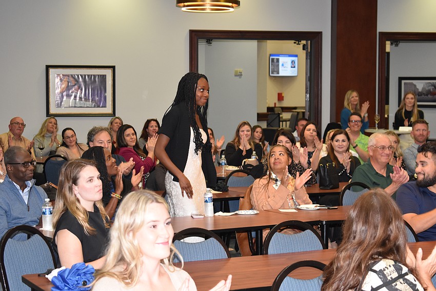 Junior Humanitarian of the Year Amy Kwakye-Amoah is acknowledged by the crowd during the volunteer awards at Gold Coast Eagle Distributing Jan. 11.