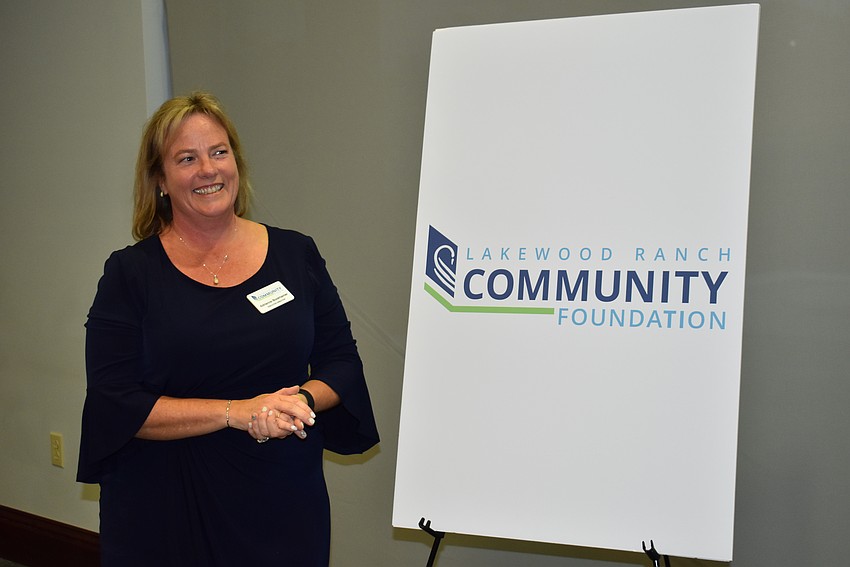 Executive Director Adrienne Bookhamer unveils the name change to Lakewood Ranch Community Foundation.