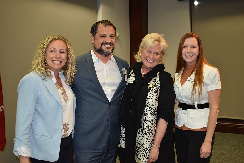 LWRBA's Brittany Lamont, LWRCA's Keith Pandeloglou, Meals on Wheels Plus' Maribeth Phillips and Safe Children Coalition's Stacey Schaeffer celebrate at the volunteer awards.