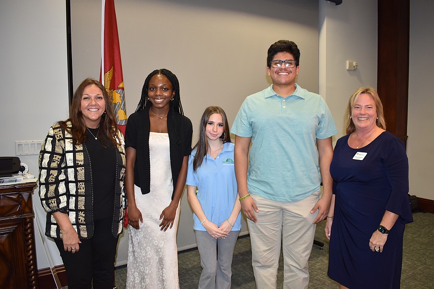 The LWR Community Foundation's Kelly Gilliland (left) and Adrienne Bookhamer (right) join Junior Humanitarian of the Year winner Amy Kwakye-Amoah and runners-up Marcella Hymes and Brayan Hernandez.