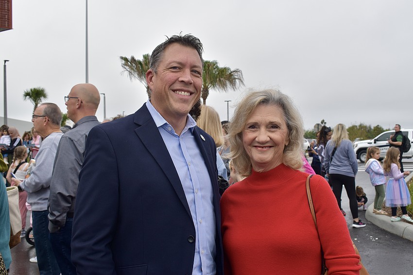 Commissioner George Kruse and former Commissioner Vanessa Baugh catch up before the grand opening.