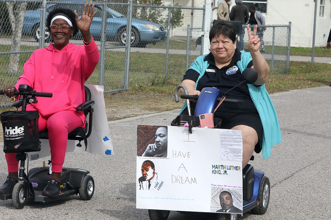 Kimberly McClendon and Bunnell City Commissioner Tina-Marie Schultz ride in Bunnell's MLK Parade. Photo by Brent Woronoff