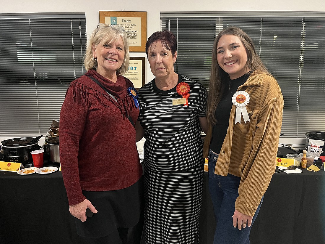 Rose Burns places second, Cindy Jackson placed first and Marissa Stephenson places third in the Manatee-Sarasota Building Industry Association's chili cook-off.