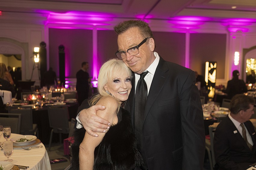 Elisabeth Waters, with keynote speaker, Tom Arnold