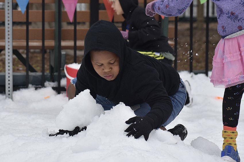 Ewan Trotman, 9, gets things together in the snow.