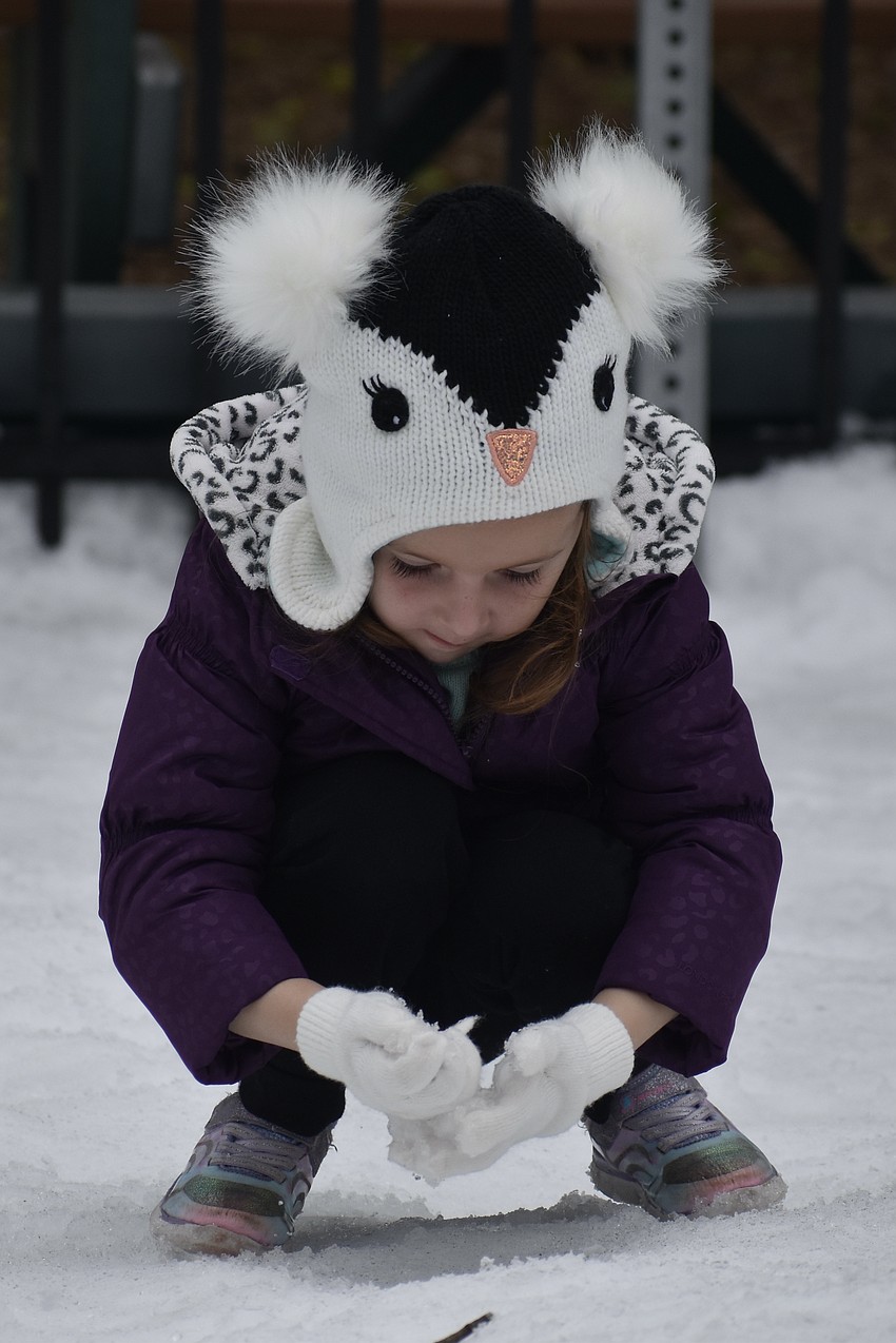 Jemma Patella, 4, explores the snow.