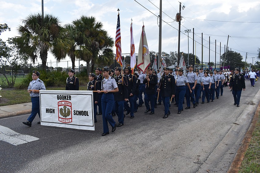 Booker High School JROTC students help lead the walk, as it leaves