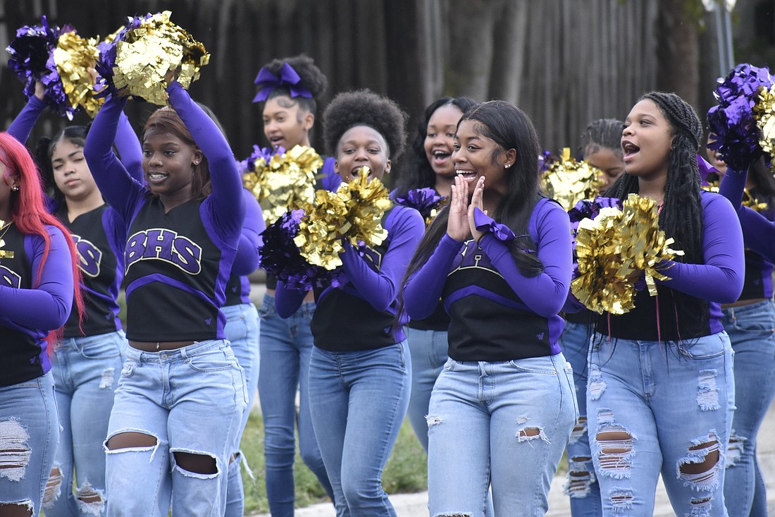 Booker High School cheerleaders bring their enthusiasm to the walk.