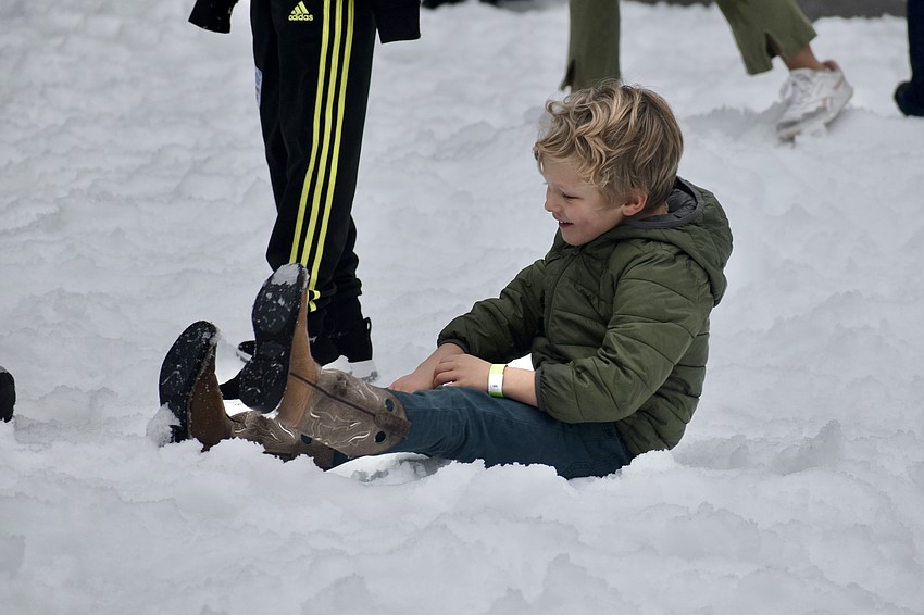 Archie Jourdonnais, 5, kicks back and enjoys the snow.