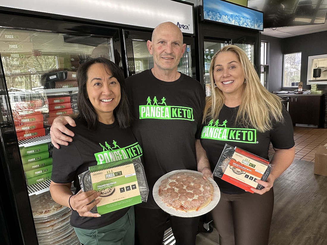 PangeaKeto franchisees Rosanna Smith, left, and Jacqueline Spring Miller, right, are joined by company founder Jeff Zucal at the bistro that is scheduled to open Jan. 17 at 14474 Beach Blvd.