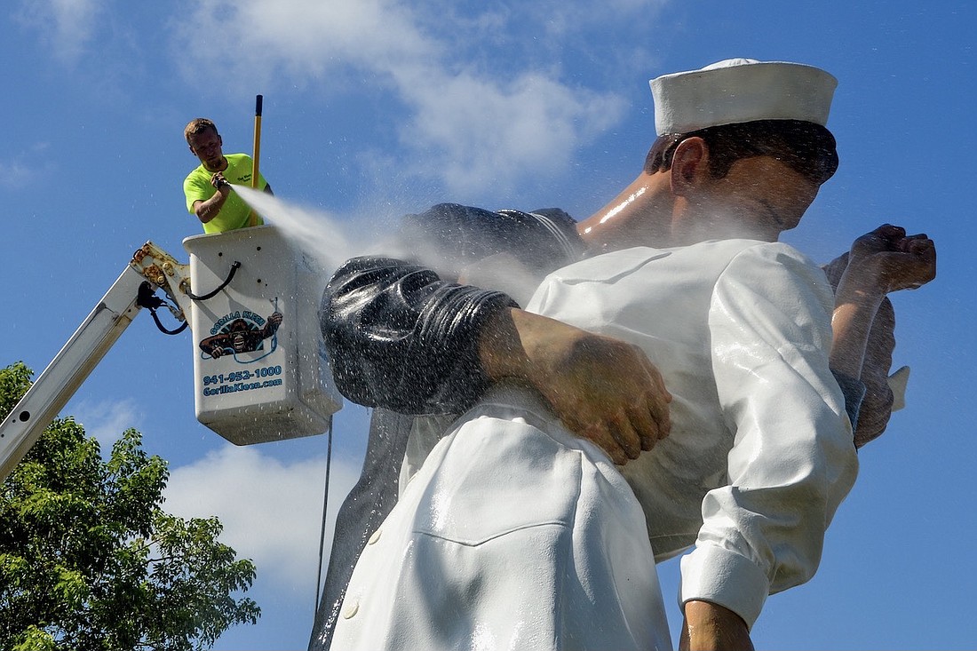 The Unconditional Surrender statue is cleaned.