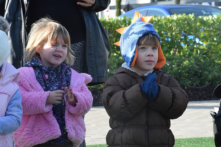 Bundled up for the cold temperature, Sarasota 2-year-olds Arleana Croce and Olin Croce are ready to dance. They love dancing to 