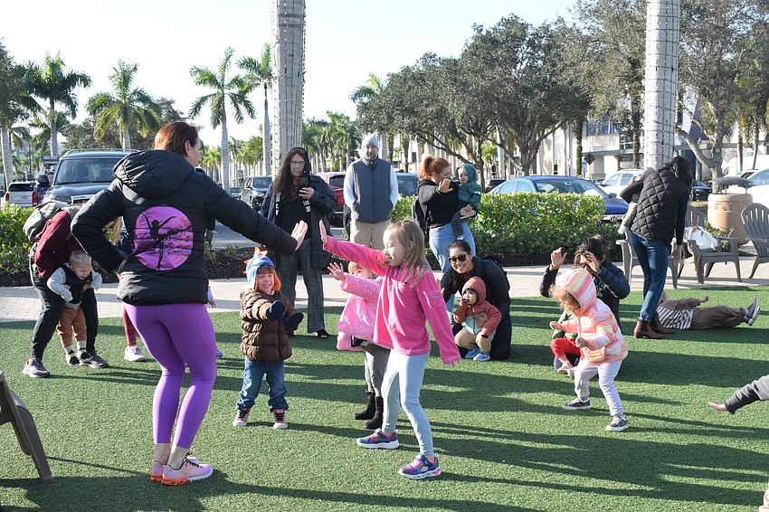 Jodi Sobol, owner of Miss Jodi's School of Dance, leads children in various dances during UTC Kids Club.
