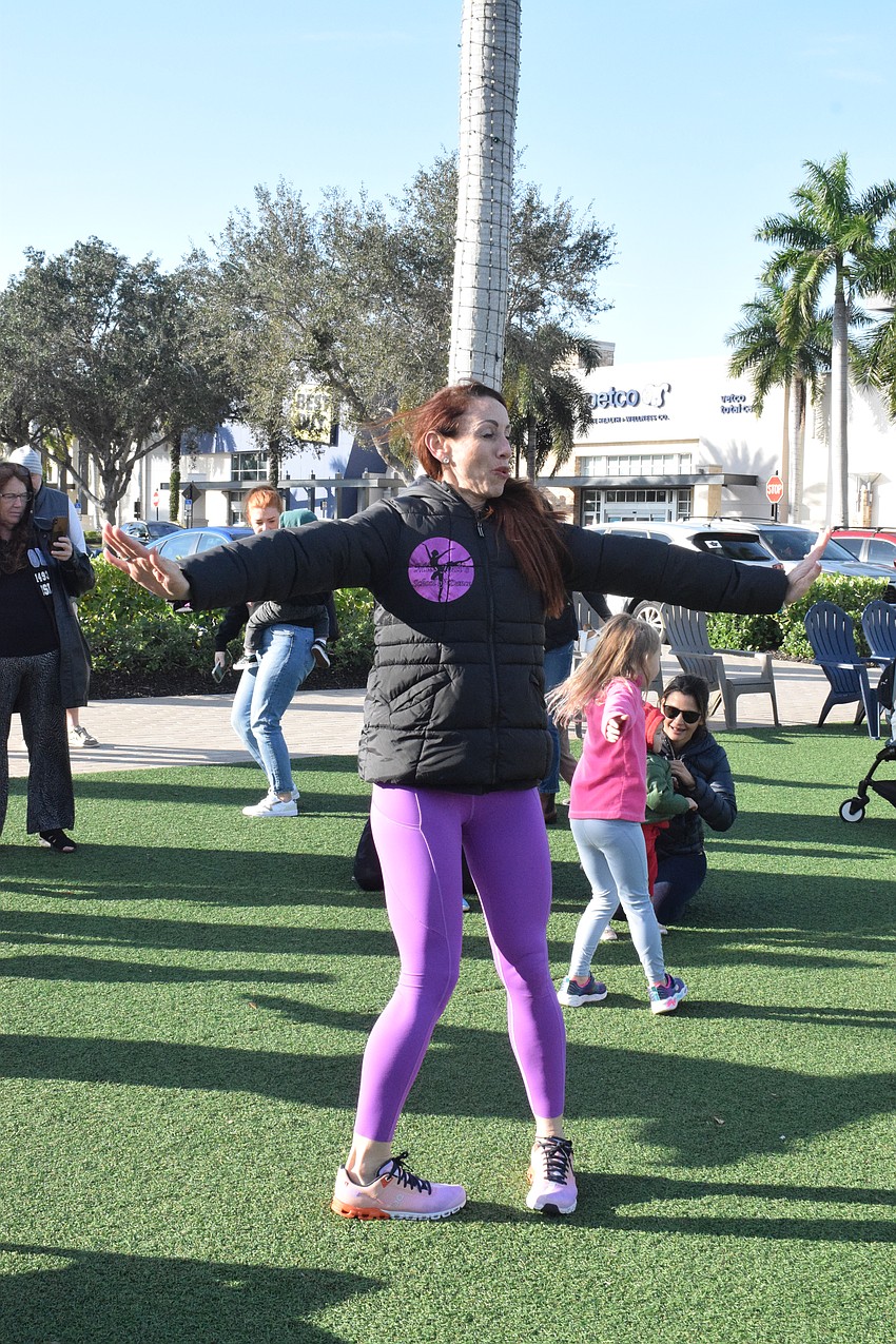 Jodi Sobol, owner of Miss Jodi's School of Dance, twirls around as part of a song.
