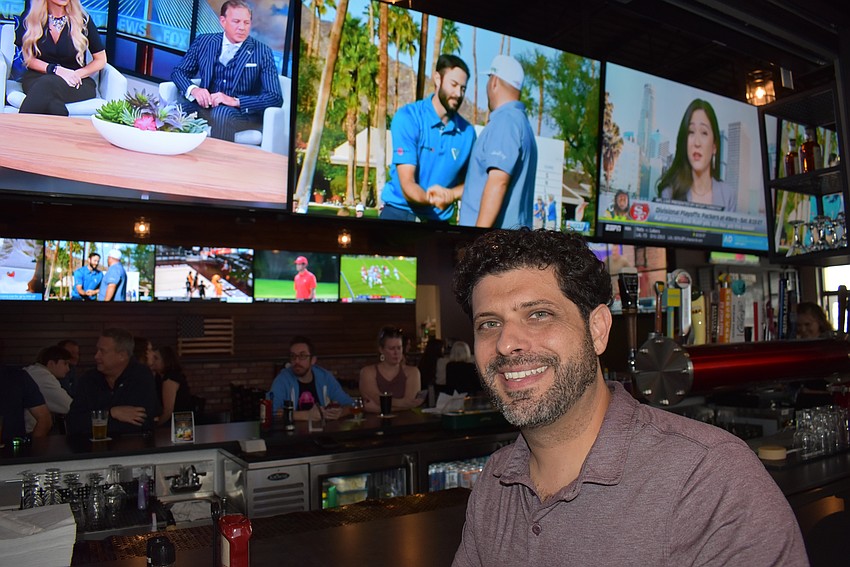 Co-owner Adam Myara made sure the new Ed's Tavern had plenty of large-screen TVs to entertain all his customers who are sports fans.