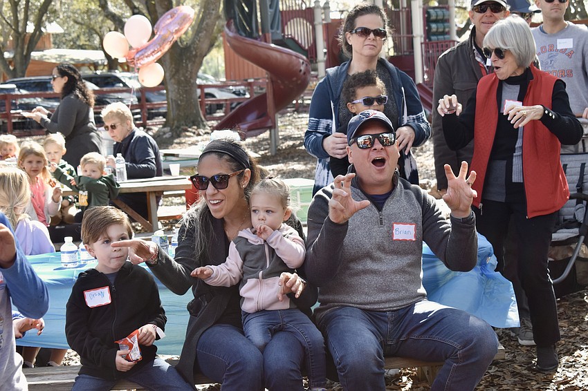 Brian Albright roars like a dinosuar.