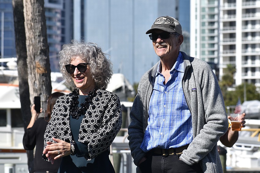 Nancy Scalera and David Heath listen to the music.