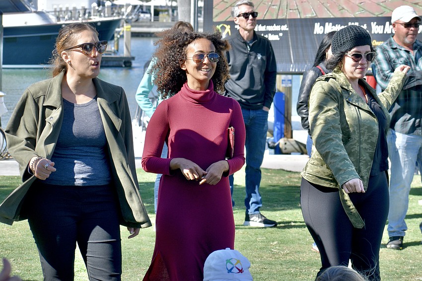 Marina Saboulard, Alex Jordan and Jill LaForest groove to the music.