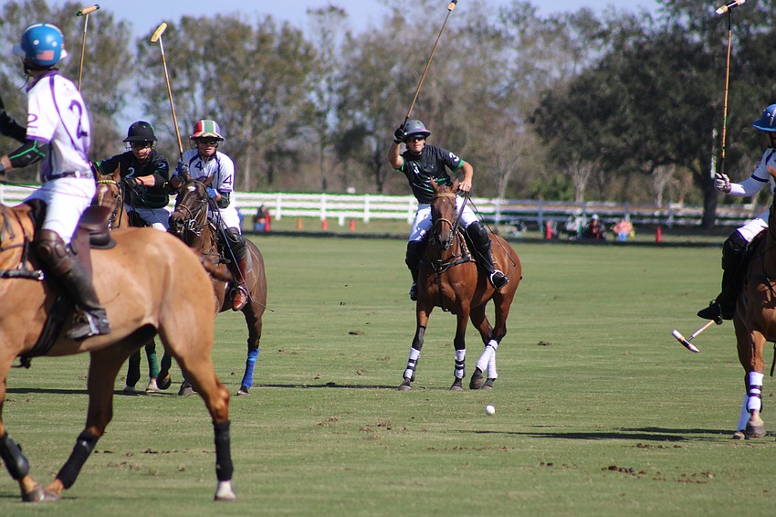Barefield/Whiskey Pond's Guille Aguero rips a shot down the middle during the Jan. 21 match against Glen Farm/Landhope at the Sarasota Polo Club.