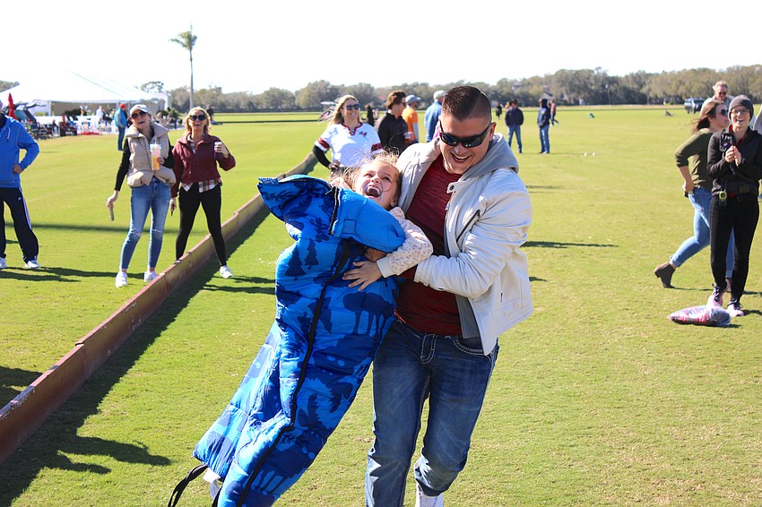 When Lakewood Ranch 7-year-old Tatum Schaper struggled during a sleeping bag sack race during halftime at the Sarasota Polo Club, her dad, Shawn Schaper, rushed forward to give her a hand. The result — a lot of fun.