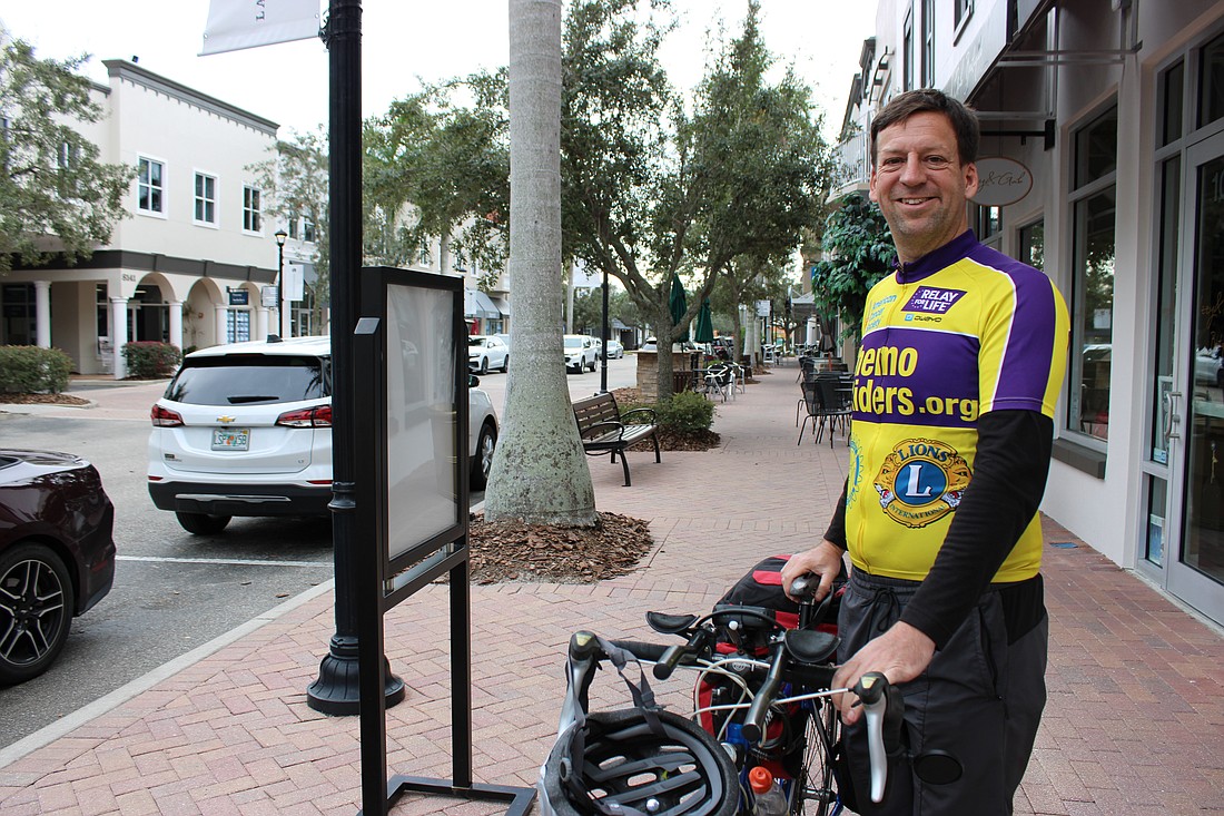Jeff Molby plans to cycle 16,000 miles over the next two years, including this leg through Main Street at Lakewood Ranch.