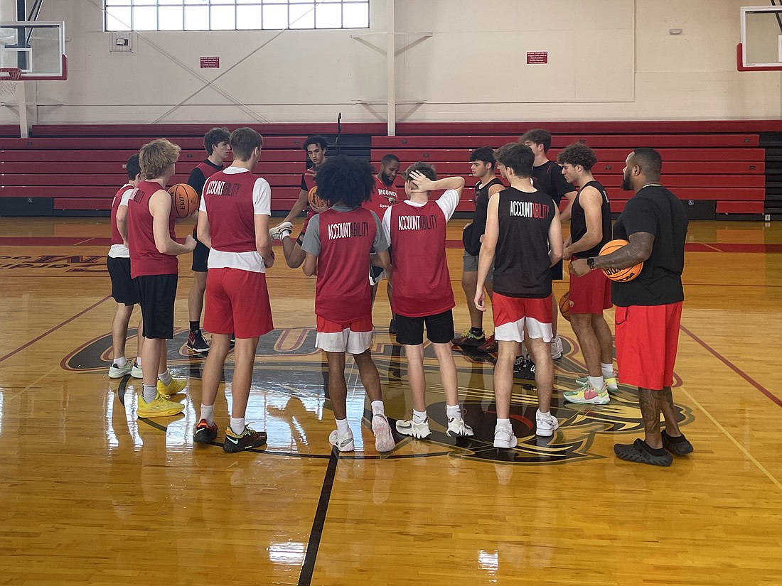 The Cardinal Mooney boys basketball teams wears "Accountability" shirts at practice.