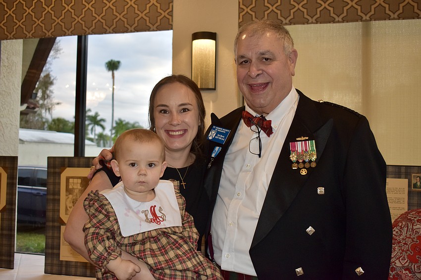 The master of ceremonies Carl Morris introduces his granddaughter Harper Morris and daughter-in-law Danielle Morris to the Burns Supper tradition for the first time.