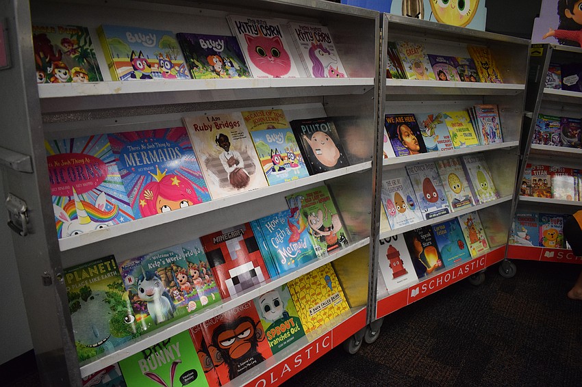 Books line the shelves at the book fair.