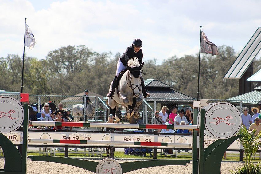 Carley Campbell soars high over a jump aboard Baretino PS.