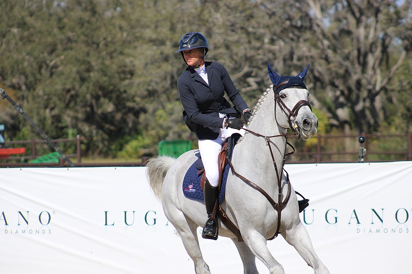 Kelly Soleau-Millar and Cacharel look toward the next jump. They missed the jump-offs.