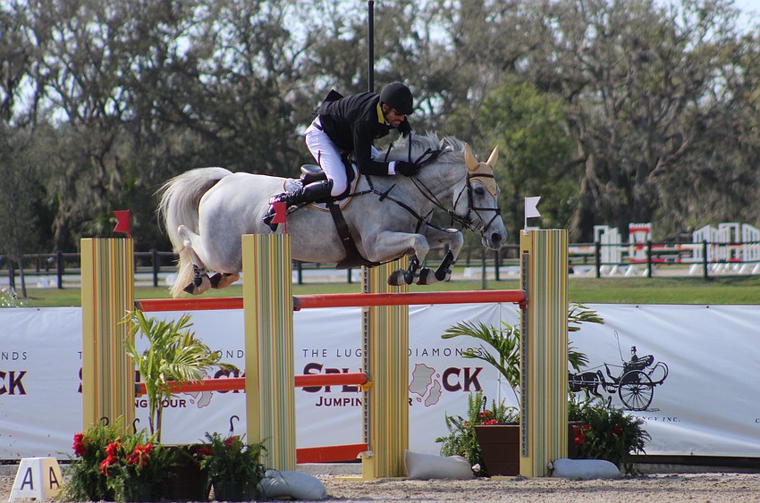 Australia's Rowan Willis soars over a jump on Wellington Grey Goose to win the jump-off of the $100,000 Lugano Diamonds Grand Prix event at TerraNova Equestrian Center in Myakka City Jan. 27. He timed 46.86 to win the $29,250 first-place prize.