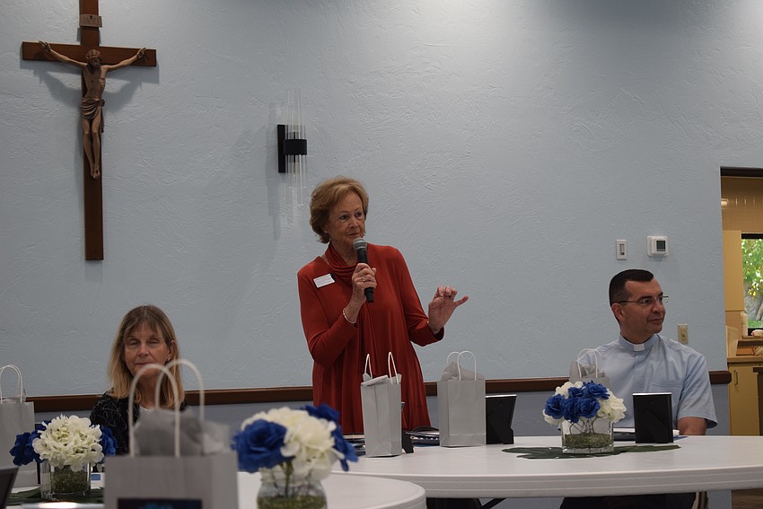 Cindy Noble welcoming new members to the St. Mary Star of the Sea Women's Guild