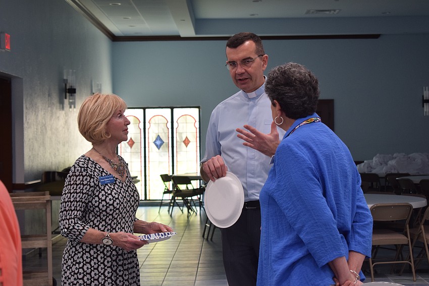 Susan Gilmore-Clarke, Father Robert Dziedziak and Mary Ann Tomlinson