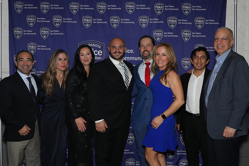 E.J. and Kelly Ledesma, Jessica and Officer Anthony Misiti, Clint and Heather Wrigley, and Carlos de Quesada and his son, Carlos.