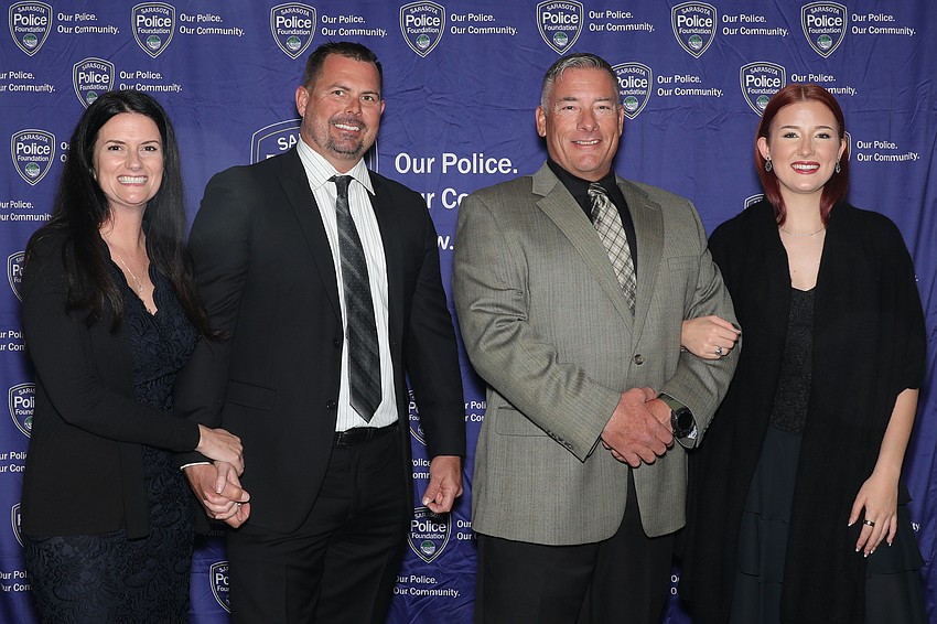 Jessica Skinner, Officers of the Year Michael Skinner and Ron Dixon, and his daughter, Mikiah Dixon. Officers Skinner and Dixon are assigned to Marine Patrol on Sarasota Bay.