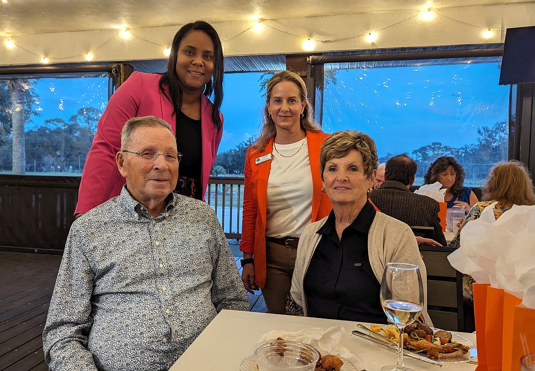 Peter and Sue Freytag (seated) with Flagler Schools Superintendent LaShakia Moore and Education Foundation Executive Director Teresa Rizzo. Photo by Brent Woronoff