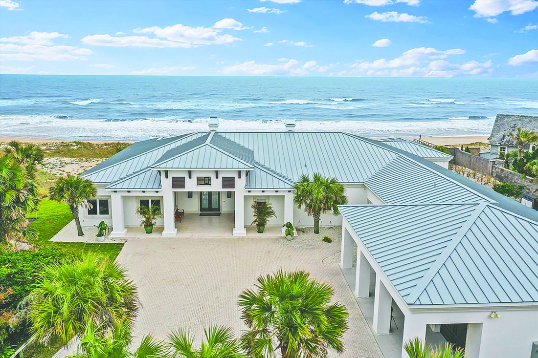 Oceanfront single-story home features four bedrooms, four full and one half-bathrooms, office, outdoor living space, pool generator and dune walkover.