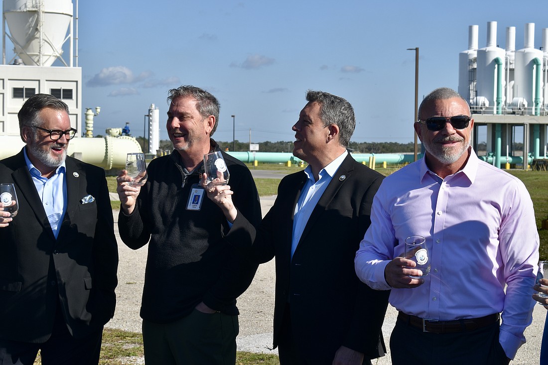 Commission Chair Mike Rahn, County Administrator Charlie Bishop, Commissioner George Kruse and Commissioner Ray Turner enjoy the first sip of water after Manatee County spent $53 million to retrofit the Lake Manatee Water Treatment Plant with new filters.