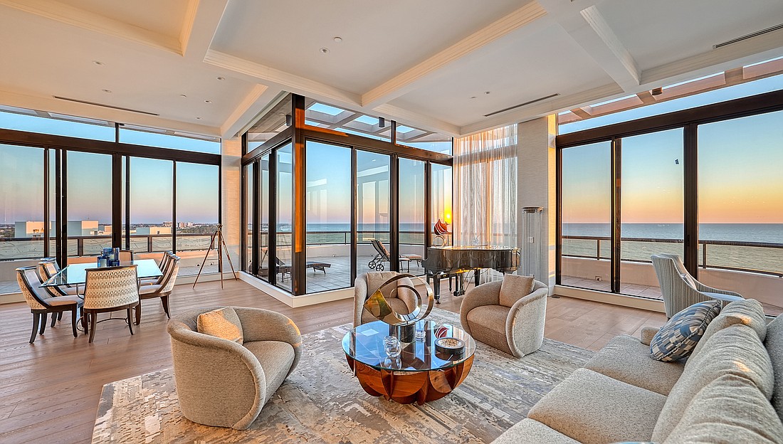 The penthouse at 415 L Ambiance Drive has floor-to-ceiling windows.