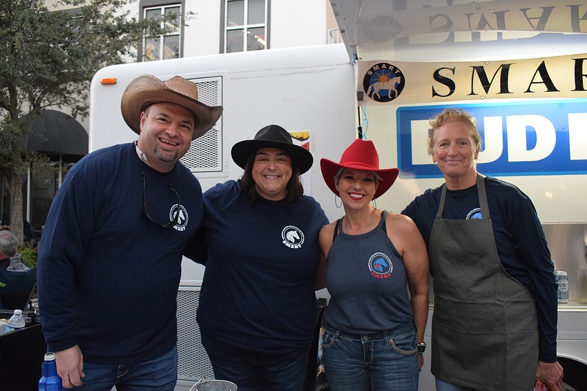 Rudy Keezer, Andrea Keezer, Angela Williams and Rosemary Stack volunteer for Sarasota Manatee Association for Riding Therapy, which was the nonprofit that benefitted from Music on Main.