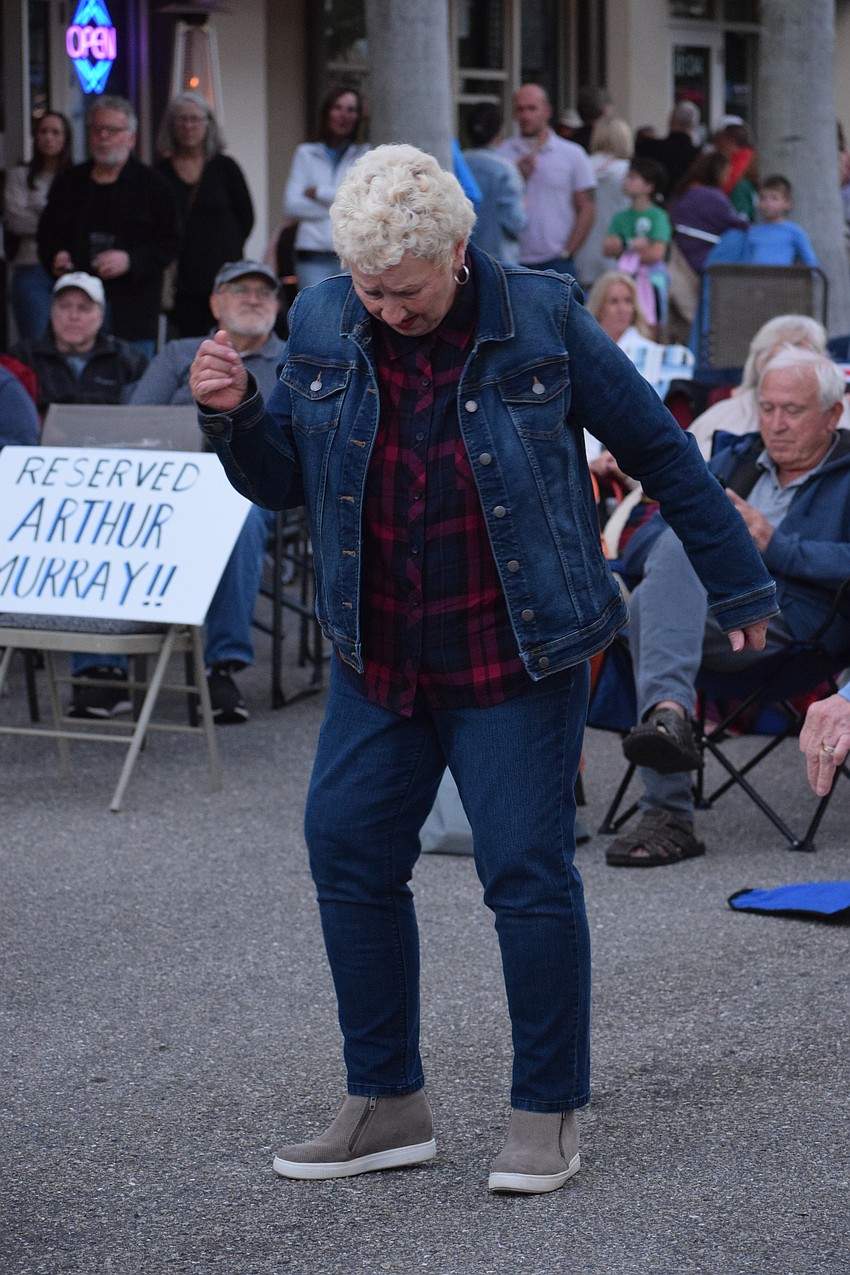 East County's Phyllis Haan busts a move while Kettle of Fish performs.