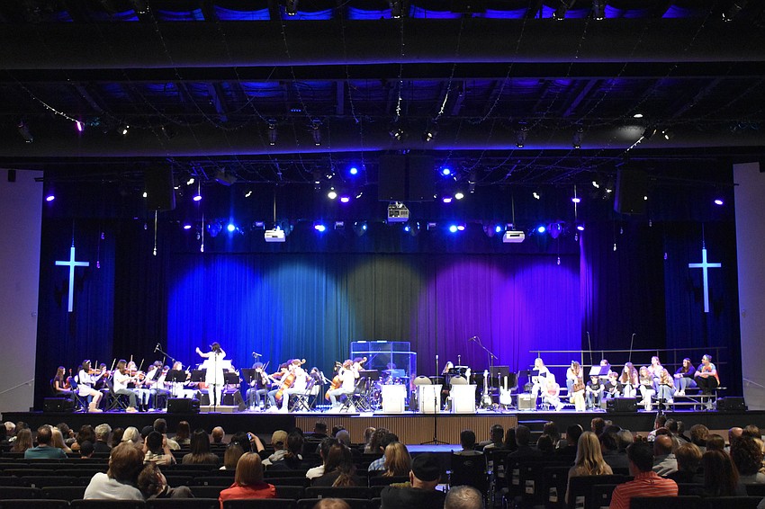 About 100 people attend a 1960s-themed orchestra performance at Woodland Community Church on Feb. 2.