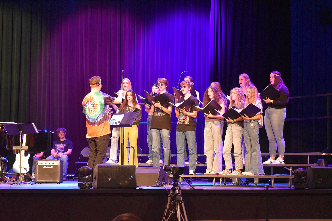 Out-of-door students and staff wear bell bottoms, head bands and John Lennon's signature sunglasses to stay on theme with the 1960s music.
