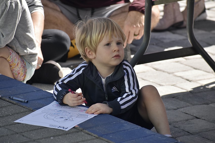 Lincoln Peterson, 2, watches the costume contest.